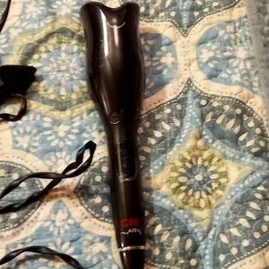 Chi Brand Spin and Curl. Temp Adjusts up to 450'.